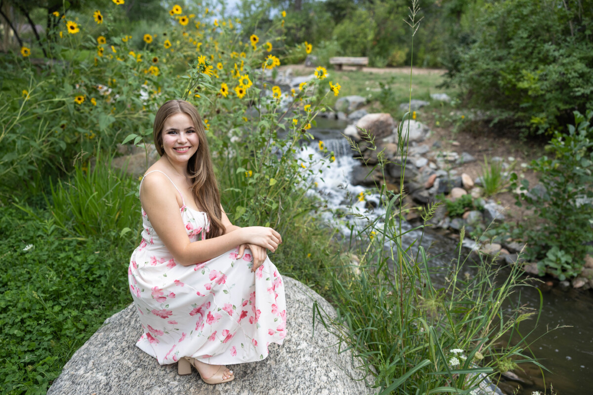 Colorado high school senior photo session with sunflowers and a stream