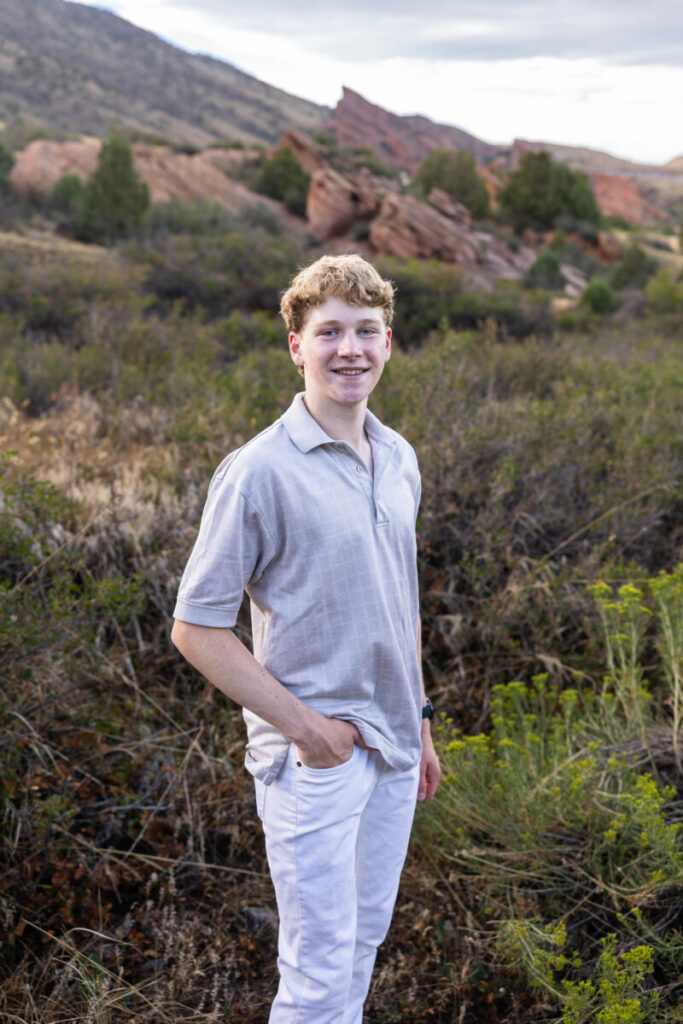 Colorado high school senior photography session with teen boy and red rocks
