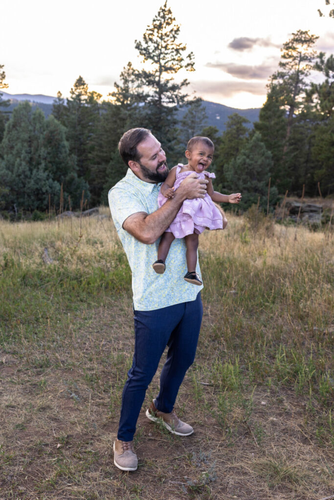 Littleton family photographer father and daughter laughing