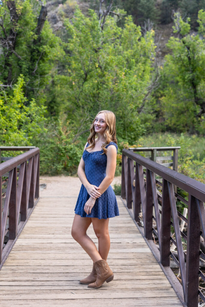 Littleton Colorado high school senior photographer at Lair O' the Bear on a bridge