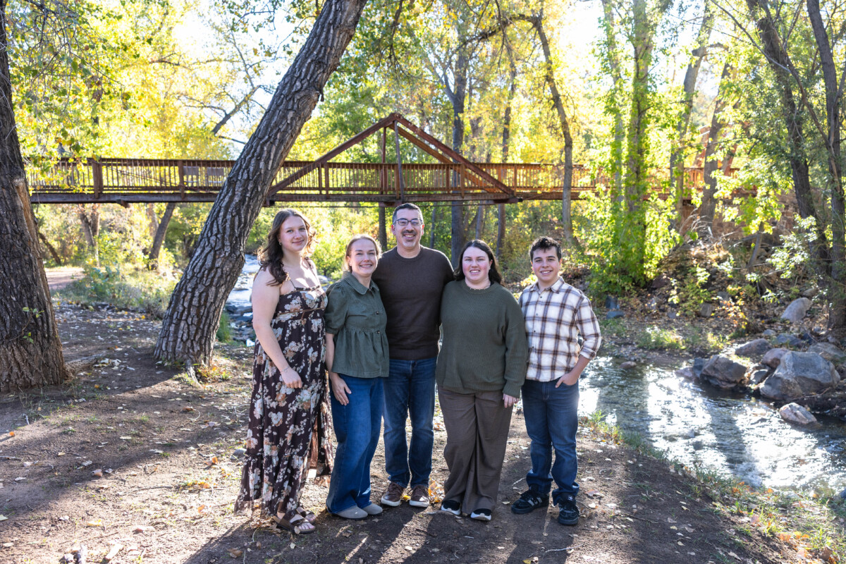 Littleton family photographer in Colorado with fall leaves