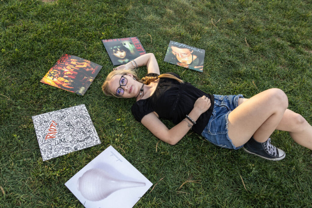Colorado high school senior photographer with a teenager and vinyls