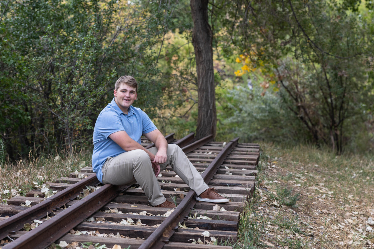 Colorado high school senior photographer with train tracks