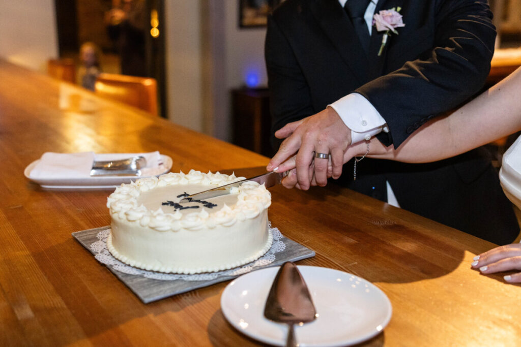 Colorado wedding photographer with cake and bride and groom