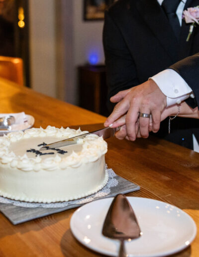 Colorado wedding photographer with cake and bride and groom