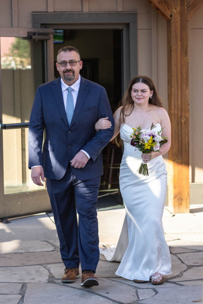 Colorado wedding photographer with bride and aisle