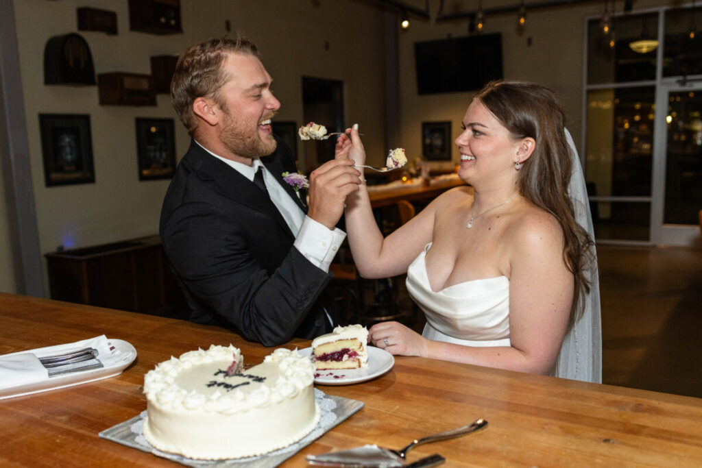 Littleton wedding photographer with cake and bride and groom at Breckenridge Brewery